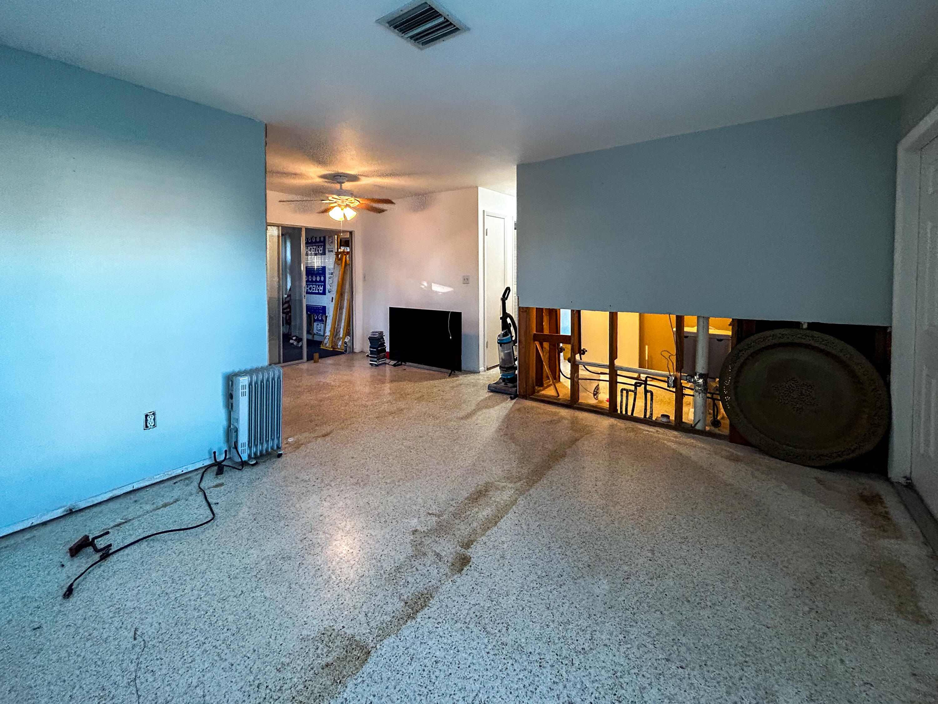 868 Lance Street Sebastian, FL 32958 - Photo 7 of 37 a view of an empty room with a fireplace