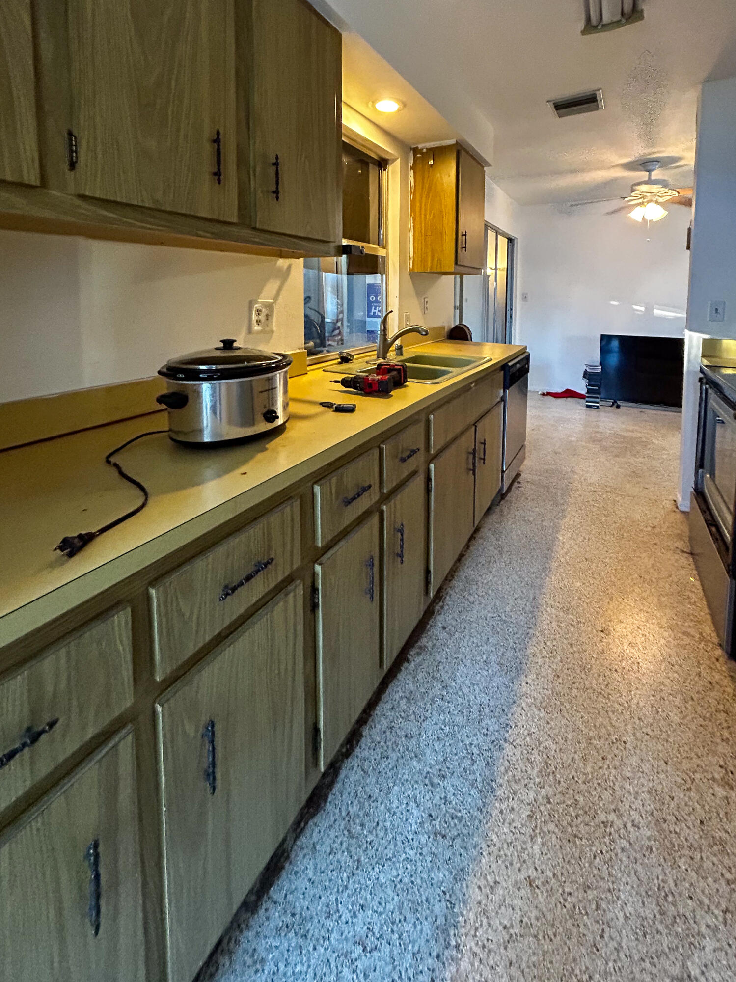 868 Lance Street Sebastian, FL 32958 - Photo 8 of 37 a kitchen with stainless steel appliances granite countertop a sink a stove and cabinets
