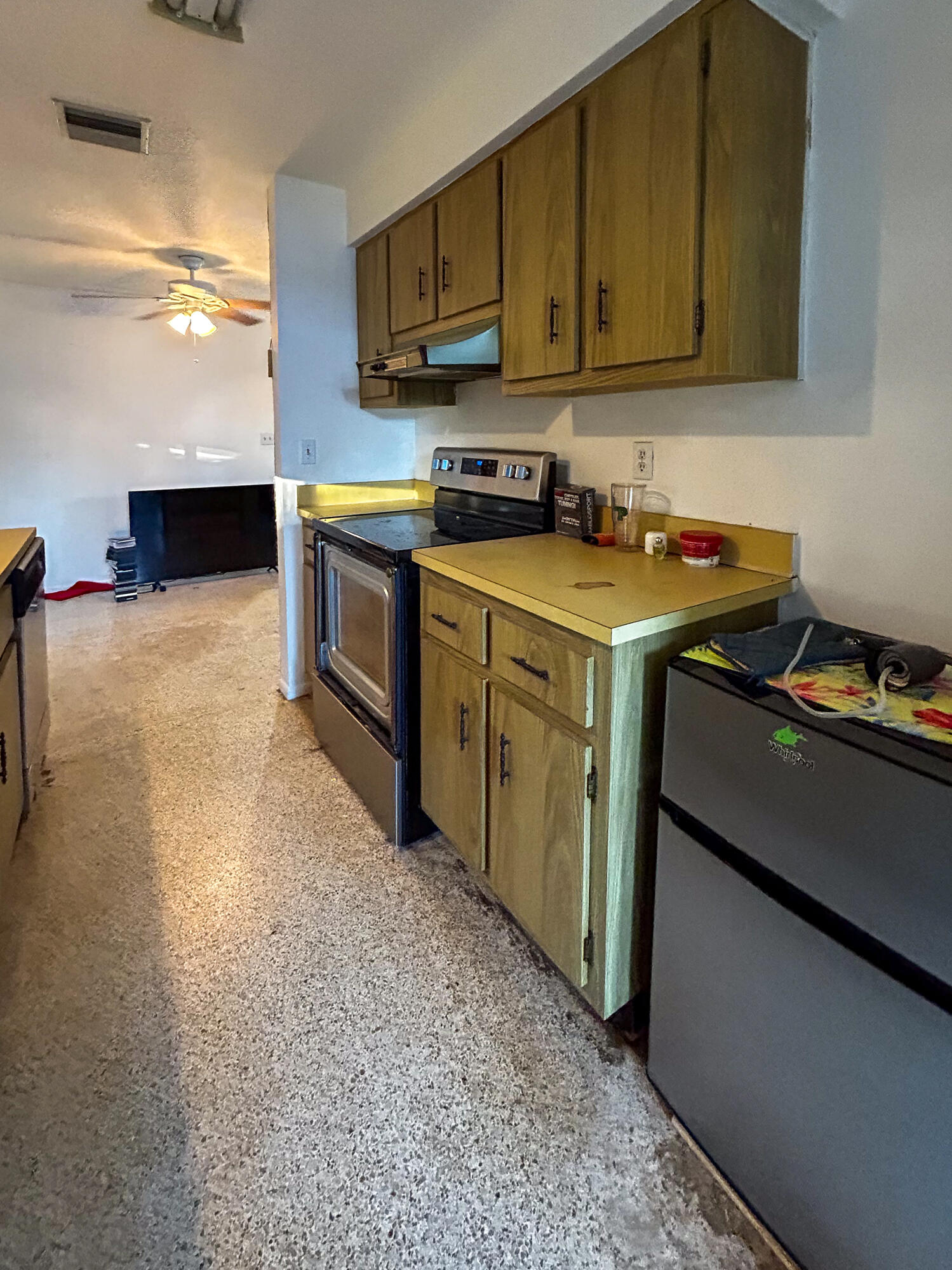 868 Lance Street Sebastian, FL 32958 - Photo 9 of 37 a kitchen with a sink and a stove top oven