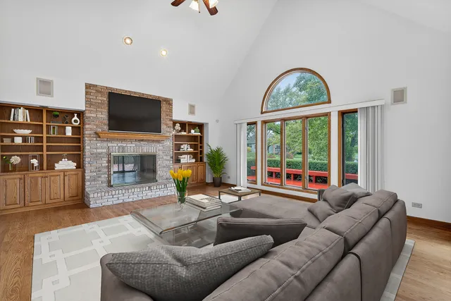 a living room with fireplace furniture and a flat screen tv