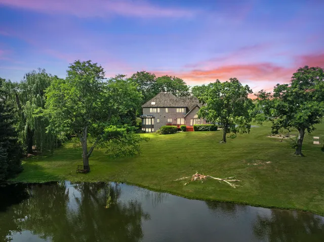 a view of a lake with a house in the background