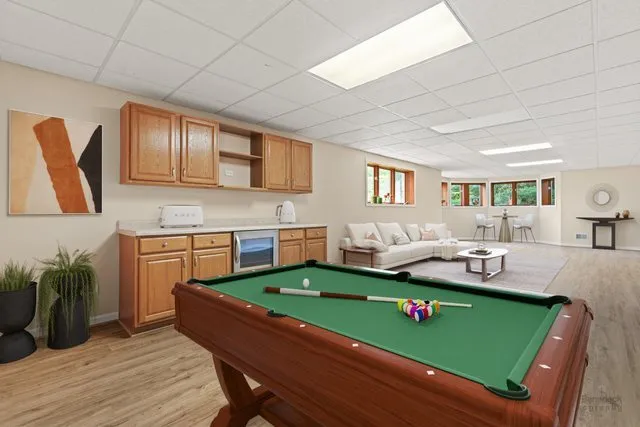 a living room with kitchen island furniture and a wooden floor