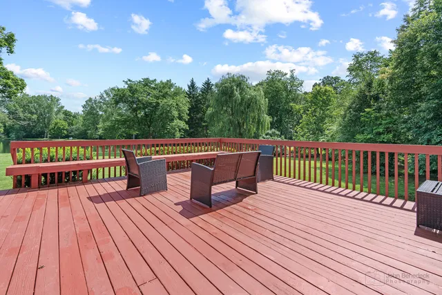 a view of a wooden deck with a bench