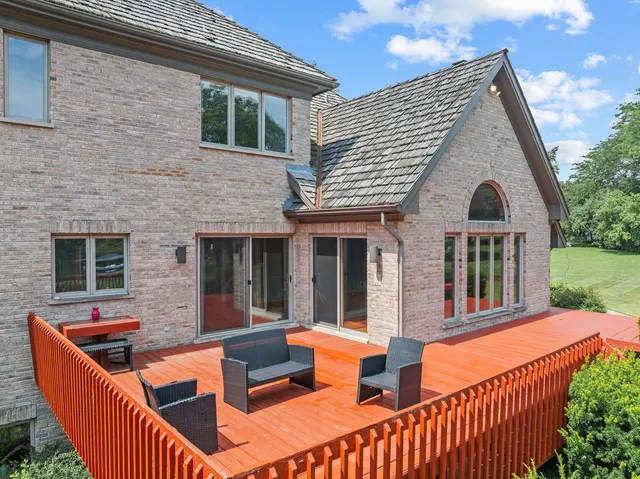 a view of house with a chairs and table in patio