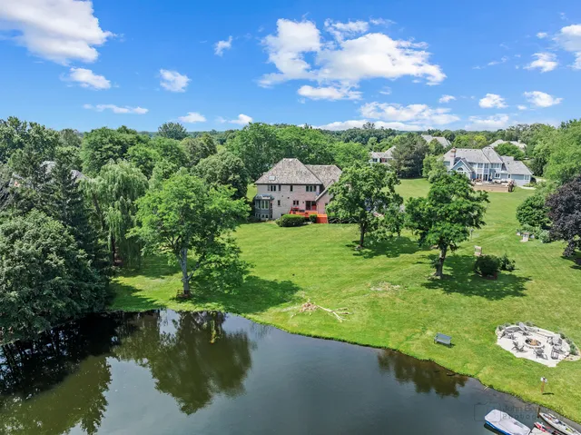 a view of a lake with a yard