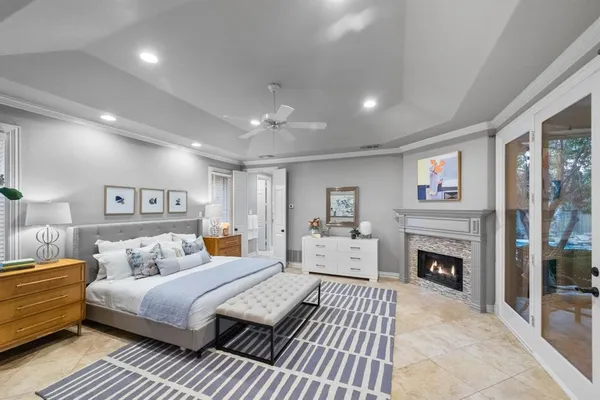 a bedroom with a bed and a fireplace