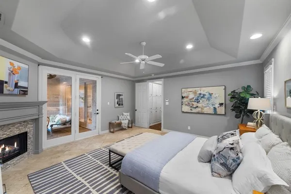 a large white kitchen with a white stove top oven and cabinets