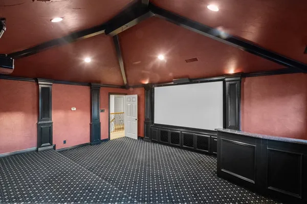 an empty room with a empty space and windows