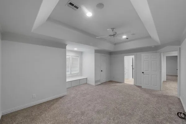 a bathroom with a granite countertop sink shower and a mirror
