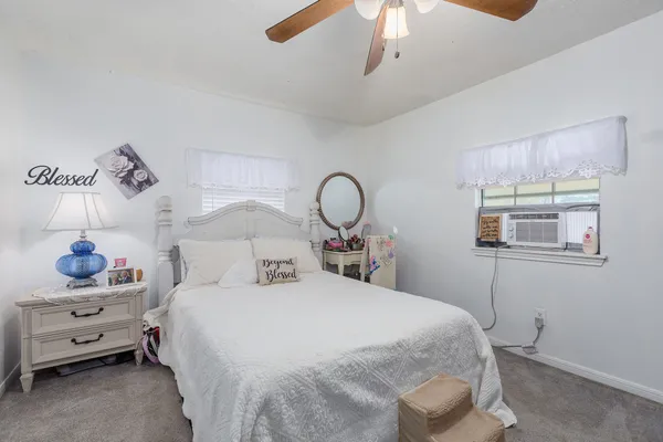 a room with wooden floor and shoes