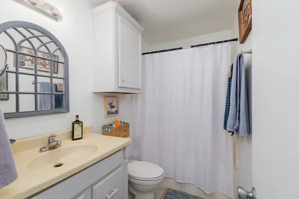 a living room filled with furniture and a chandelier