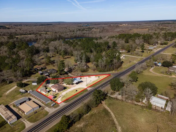 an aerial view of house with yard