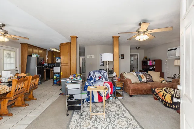 a dining room with furniture and window