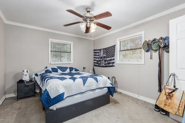 a bathroom with a sink vanity mirror and toilet