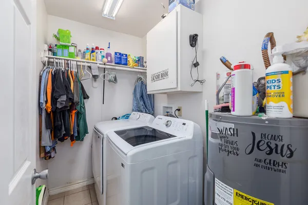 a view of a house with a yard covered in snow