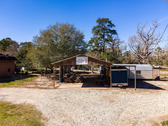 a view of a chairs and table in backyard