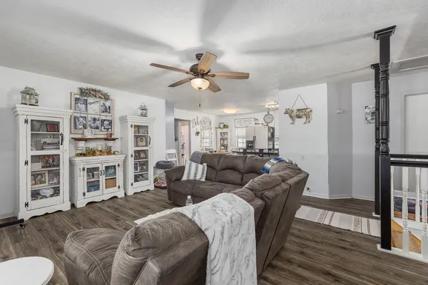 a living room with fireplace furniture and a flat screen tv
