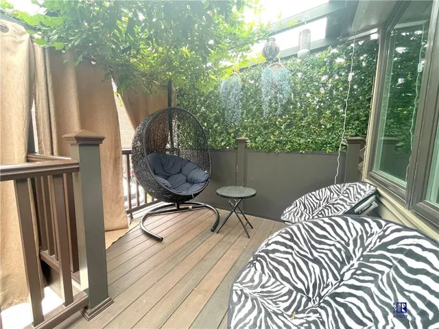 a table and chairs in a balcony