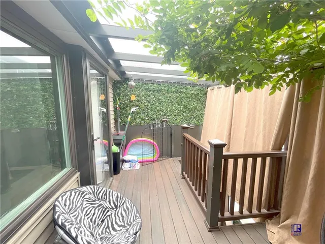 a balcony view with a seating space