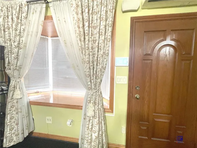 a view of entry way with wooden door