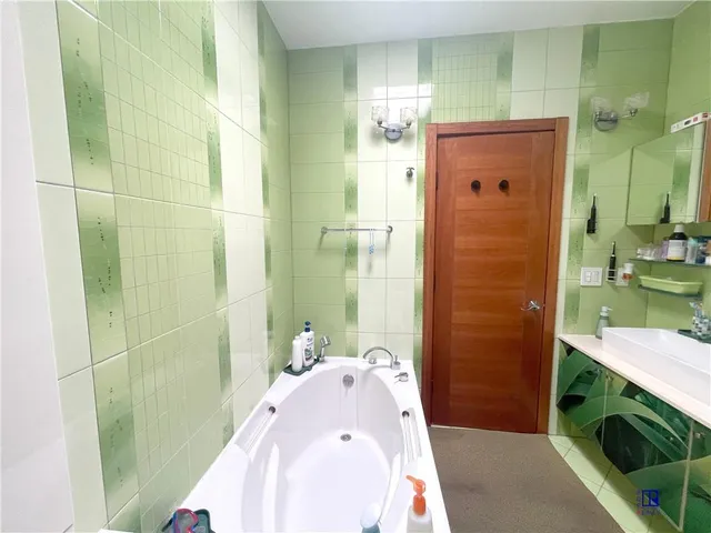 a bathroom with a sink and toilet