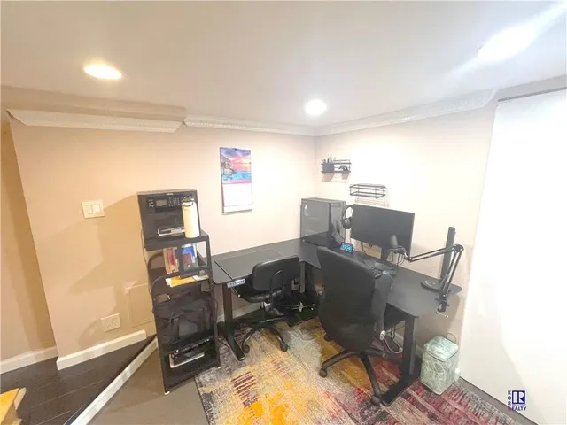 a view of a hallway with seating area