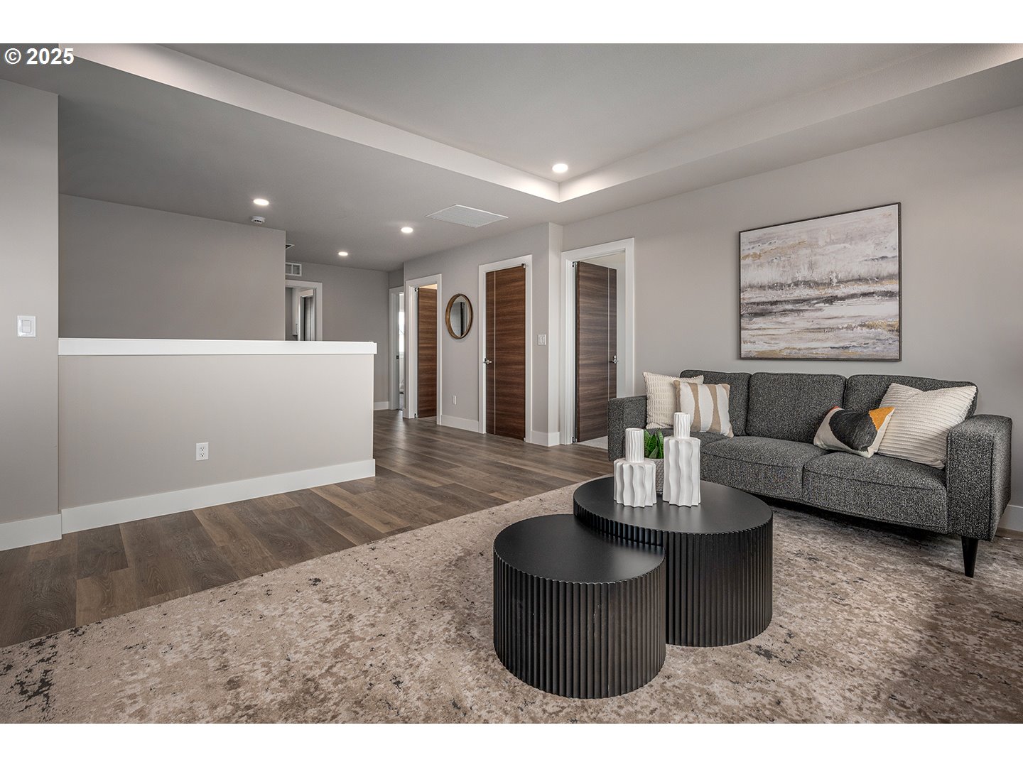 7083 Southwest Alder Lane Wilsonville, OR 97070 - Photo 18 of 35 a living room with furniture and a wooden floor