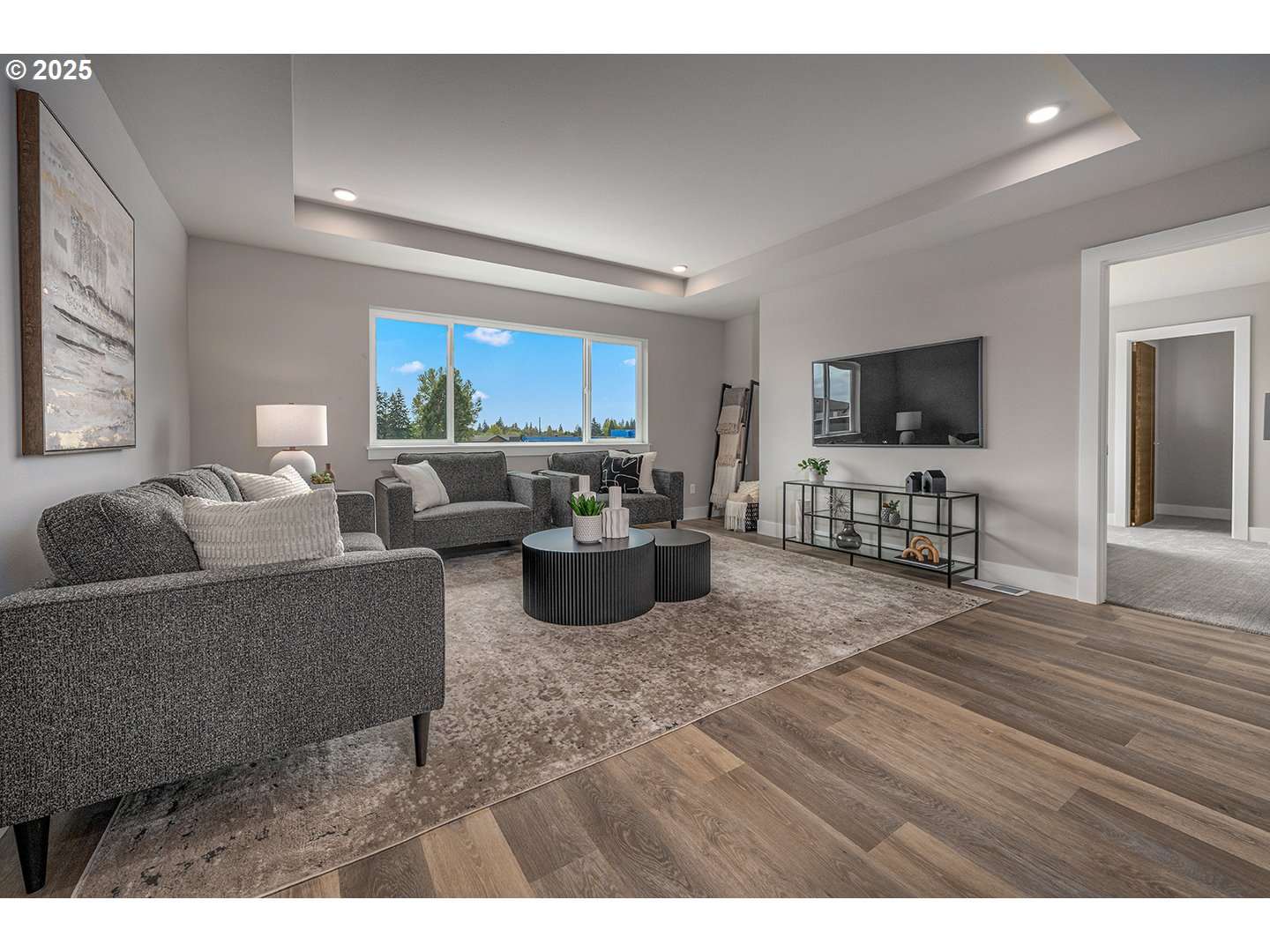 7083 Southwest Alder Lane Wilsonville, OR 97070 - Photo 19 of 35 a living room with furniture and a flat screen tv