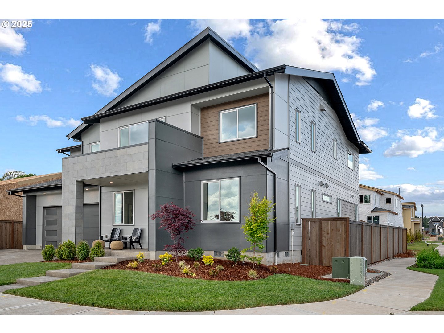7083 Southwest Alder Lane Wilsonville, OR 97070 - Photo 3 of 35 a front view of a house with garden