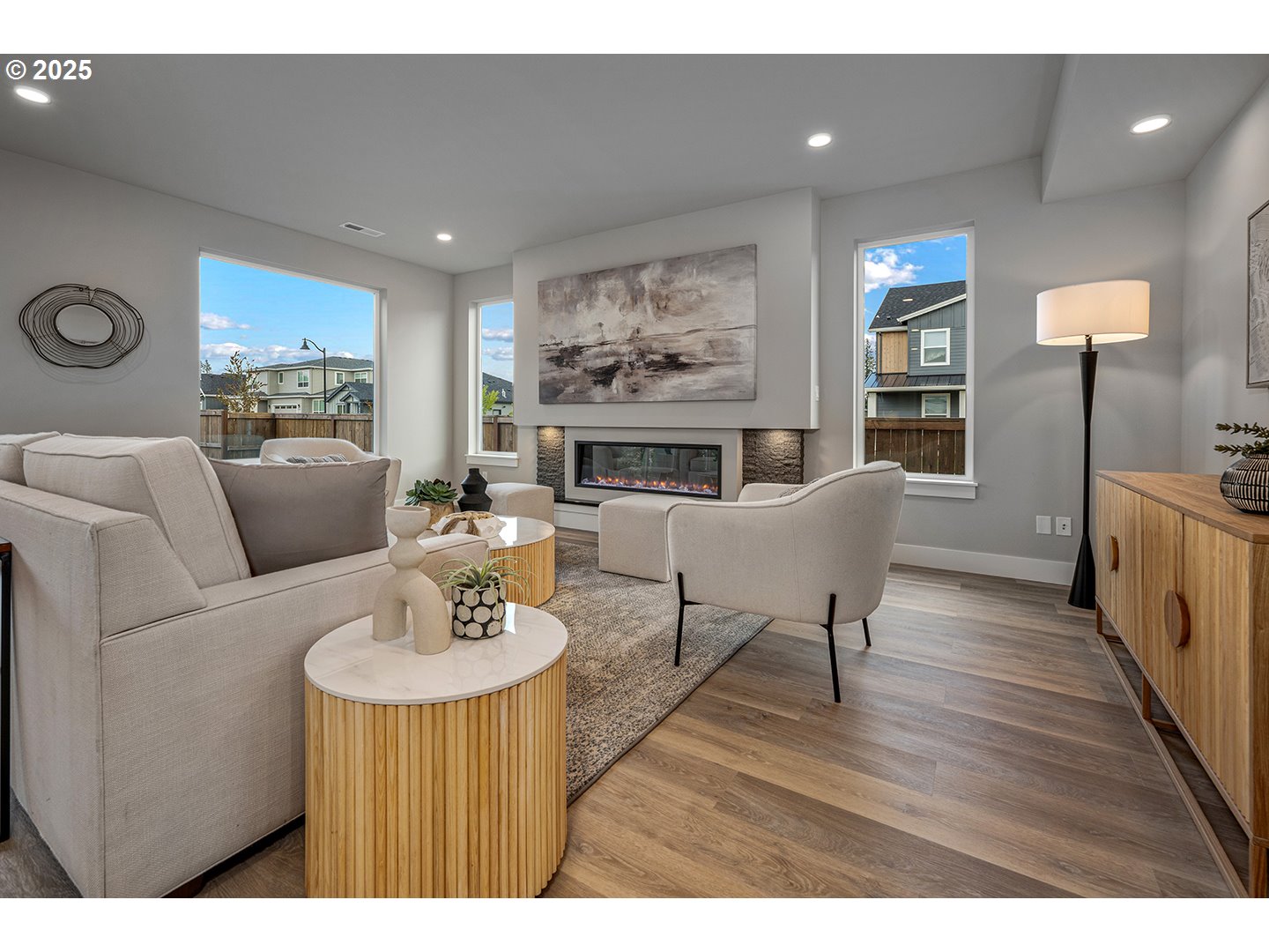 7083 Southwest Alder Lane Wilsonville, OR 97070 - Photo 6 of 35 a living room with furniture and a wooden floor