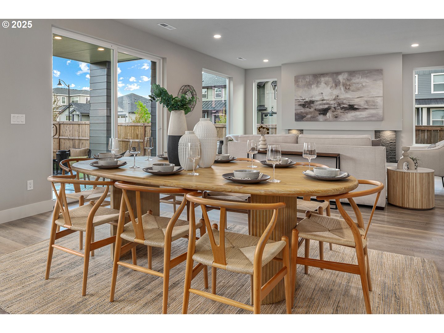 7083 Southwest Alder Lane Wilsonville, OR 97070 - Photo 9 of 35 a dining room with furniture and wooden floor