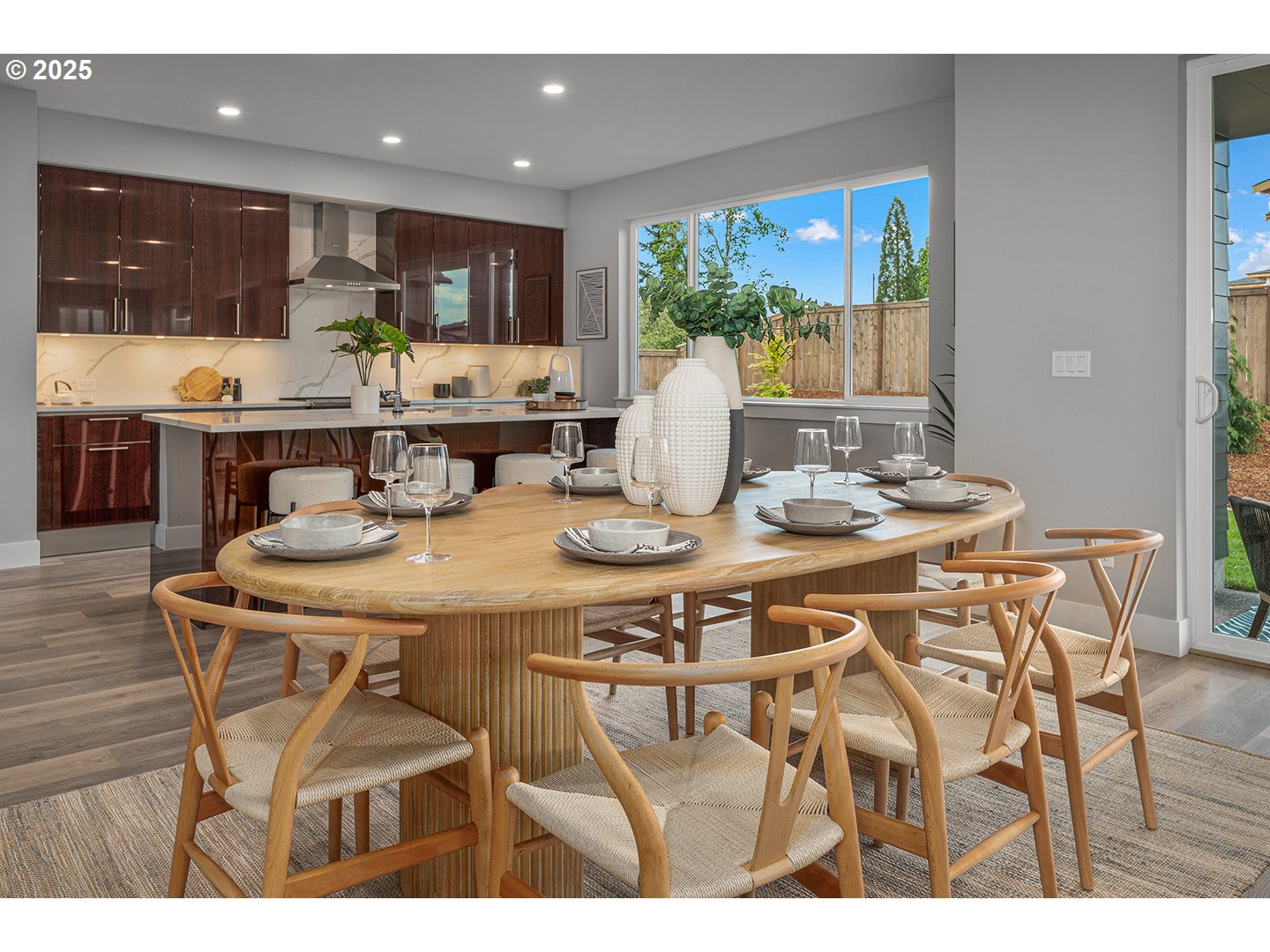 7083 Southwest Alder Lane Wilsonville, OR 97070 - Photo 10 of 35 a kitchen with a table and chairs in it