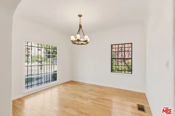 a view of empty room with windows