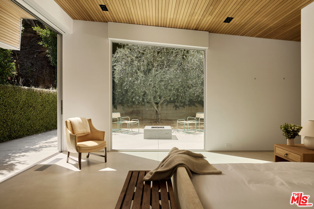 1549 Rising Glen Road Los Angeles, CA 90069 - Photo 12 of 24 a view of a dining room with furniture window and outside view