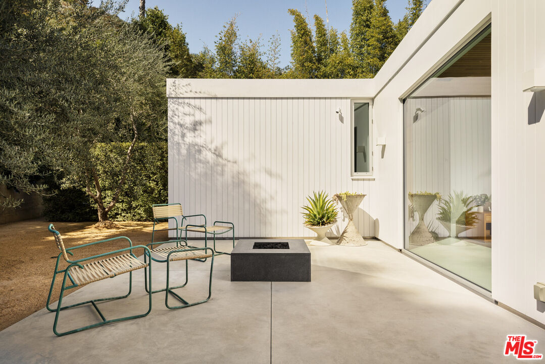 1549 Rising Glen Road Los Angeles, CA 90069 - Photo 14 of 24 a backyard of a house with outdoor seating