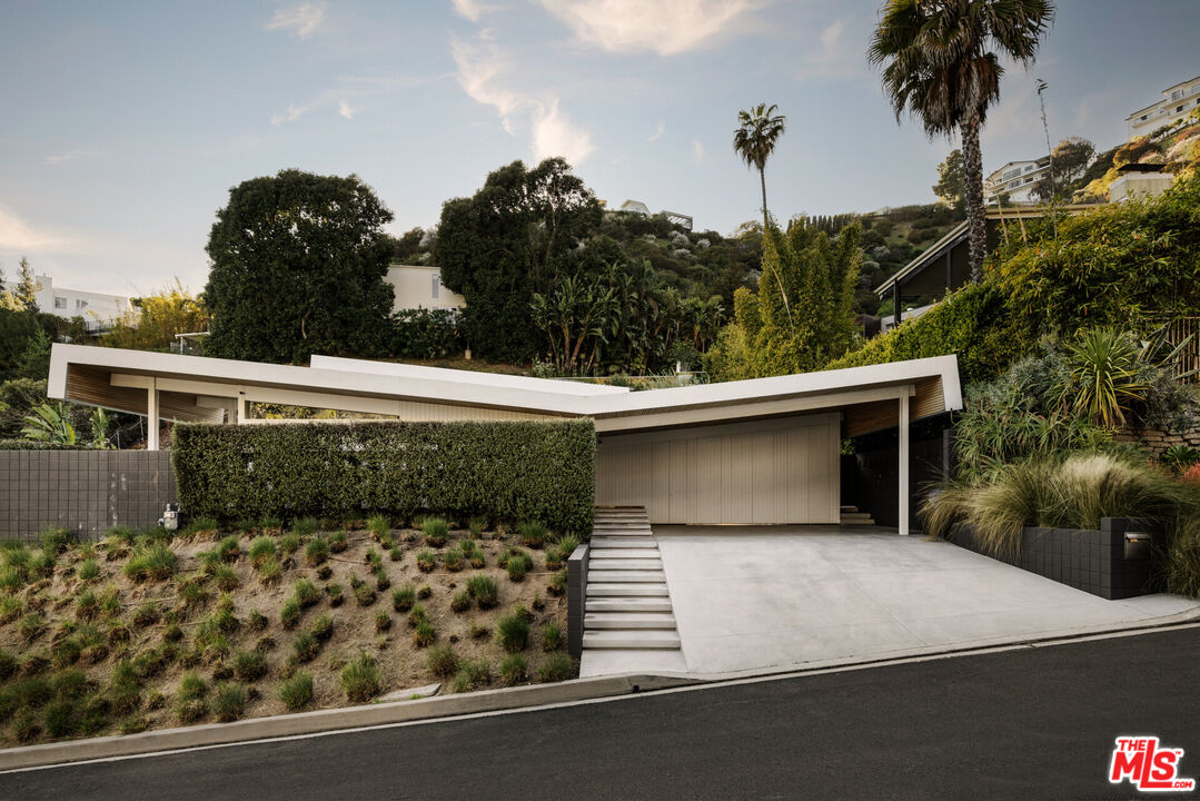 1549 Rising Glen Road Los Angeles, CA 90069 - Photo 2 of 24 front view of a house with a yard