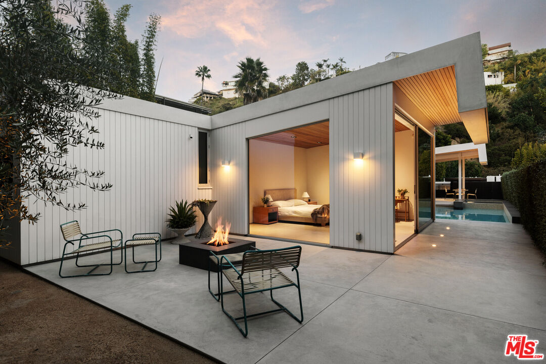 1549 Rising Glen Road Los Angeles, CA 90069 - Photo 21 of 24 a living room with furniture and a potted plant