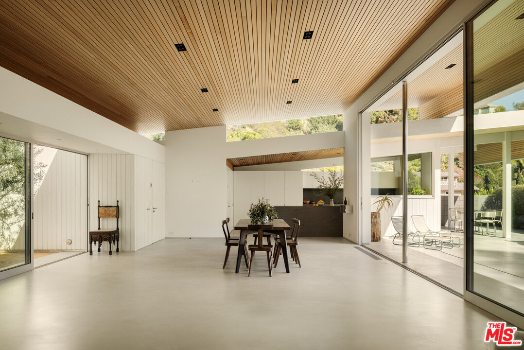 1549 Rising Glen Road Los Angeles, CA 90069 - Photo 5 of 24 a view of a livingroom with furniture table and white walls