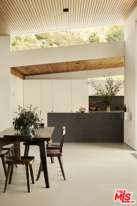 1549 Rising Glen Road Los Angeles, CA 90069 - Photo 8 of 24 a view of a terrace with furniture and a potted plant