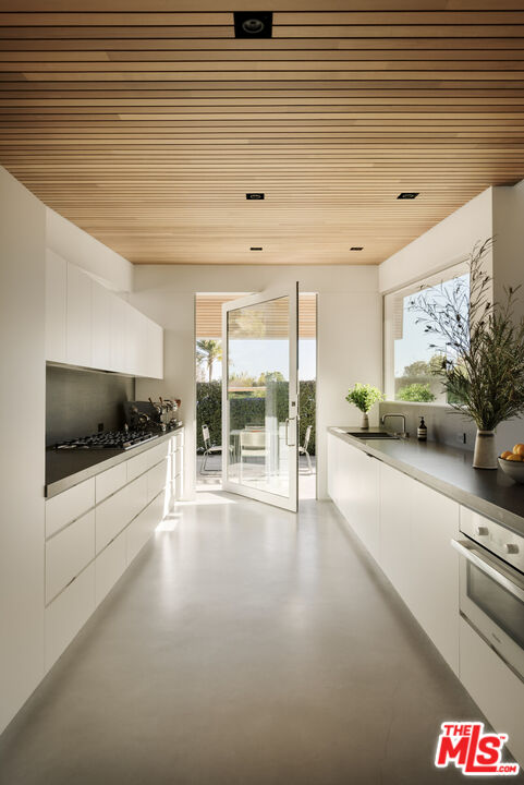 1549 Rising Glen Road Los Angeles, CA 90069 - Photo 9 of 24 a view of a living room and a flat screen tv