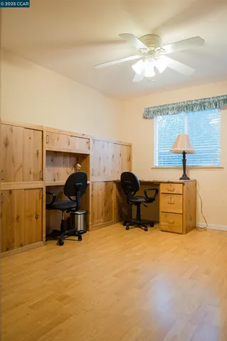 a bed room with furniture and a lamp