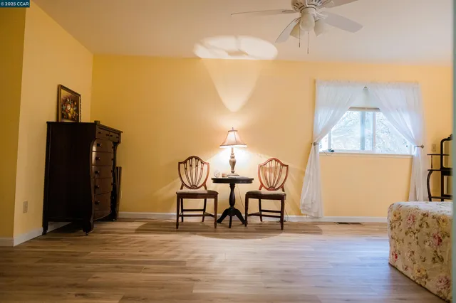 a view of a livingroom with furniture and a chandelier