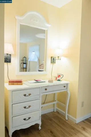 a room with a sink and a mirror