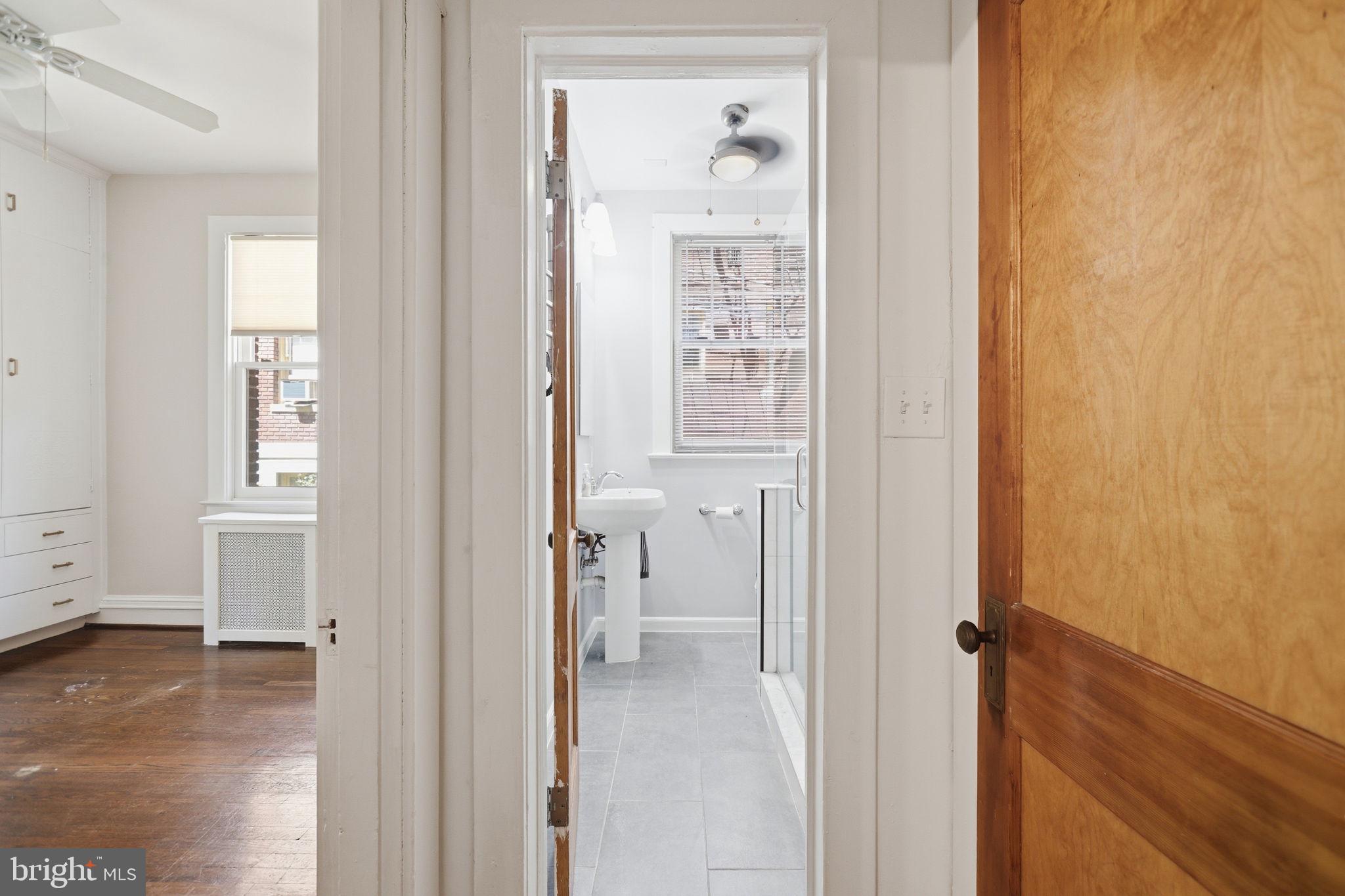 3018 Porter Street Northwest, Unit 103 Washington, DC 20008 - Photo 19 of 27 Charming entryway to modern bath.
