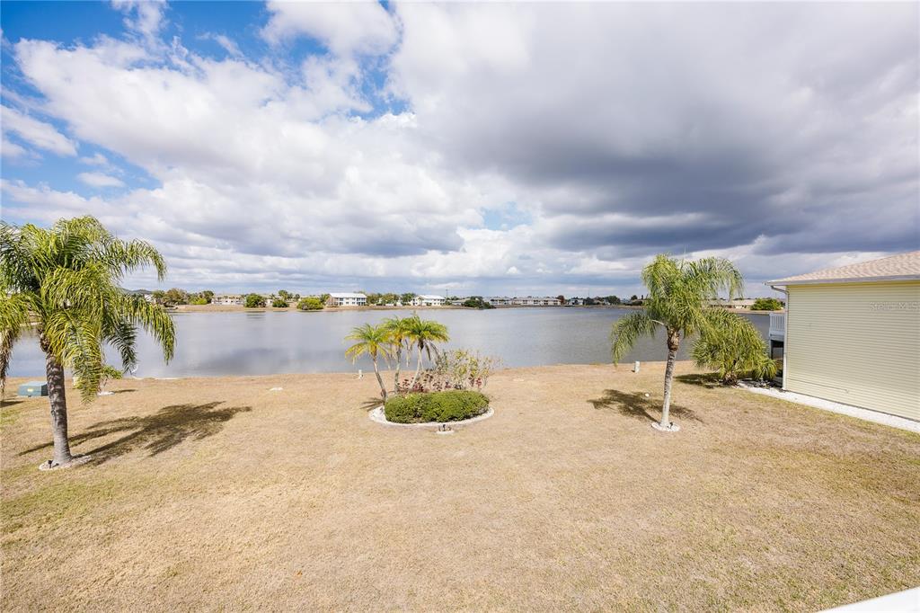 26282 Rampart Boulevard, Unit 204 Punta Gorda, FL 33983 - Photo 28 of 34 a view of a lake