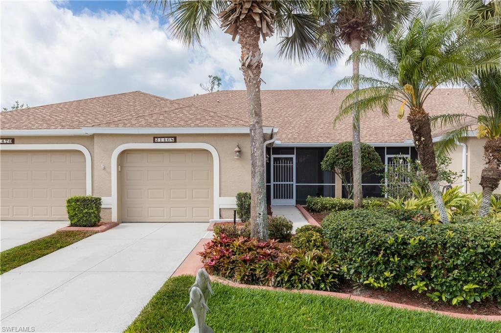 21468 Knighton Run Estero, FL 33928 - Photo 1 of 21 front view of a house with a garden