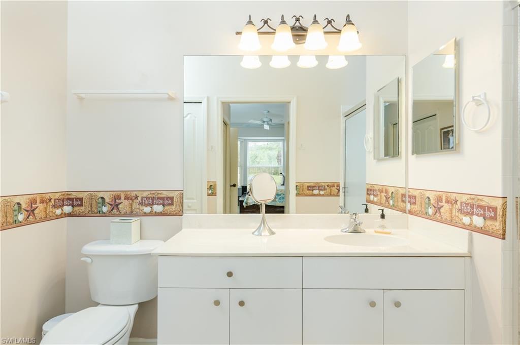 21468 Knighton Run Estero, FL 33928 - Photo 12 of 21 a bathroom with a sink mirror and vanity