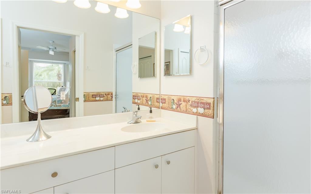 21468 Knighton Run Estero, FL 33928 - Photo 13 of 21 a bathroom with a sink and a mirror
