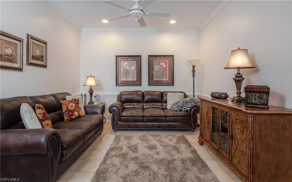 21468 Knighton Run Estero, FL 33928 - Photo 7 of 21 a living room with furniture and a lamp