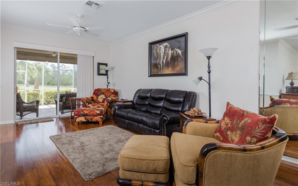 21468 Knighton Run Estero, FL 33928 - Photo 8 of 21 a living room with furniture and wooden floor